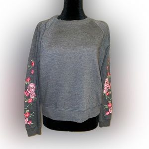 Women’s Aeropostale sweatshirt w/ embroidered flowers on sleeves. Size M.